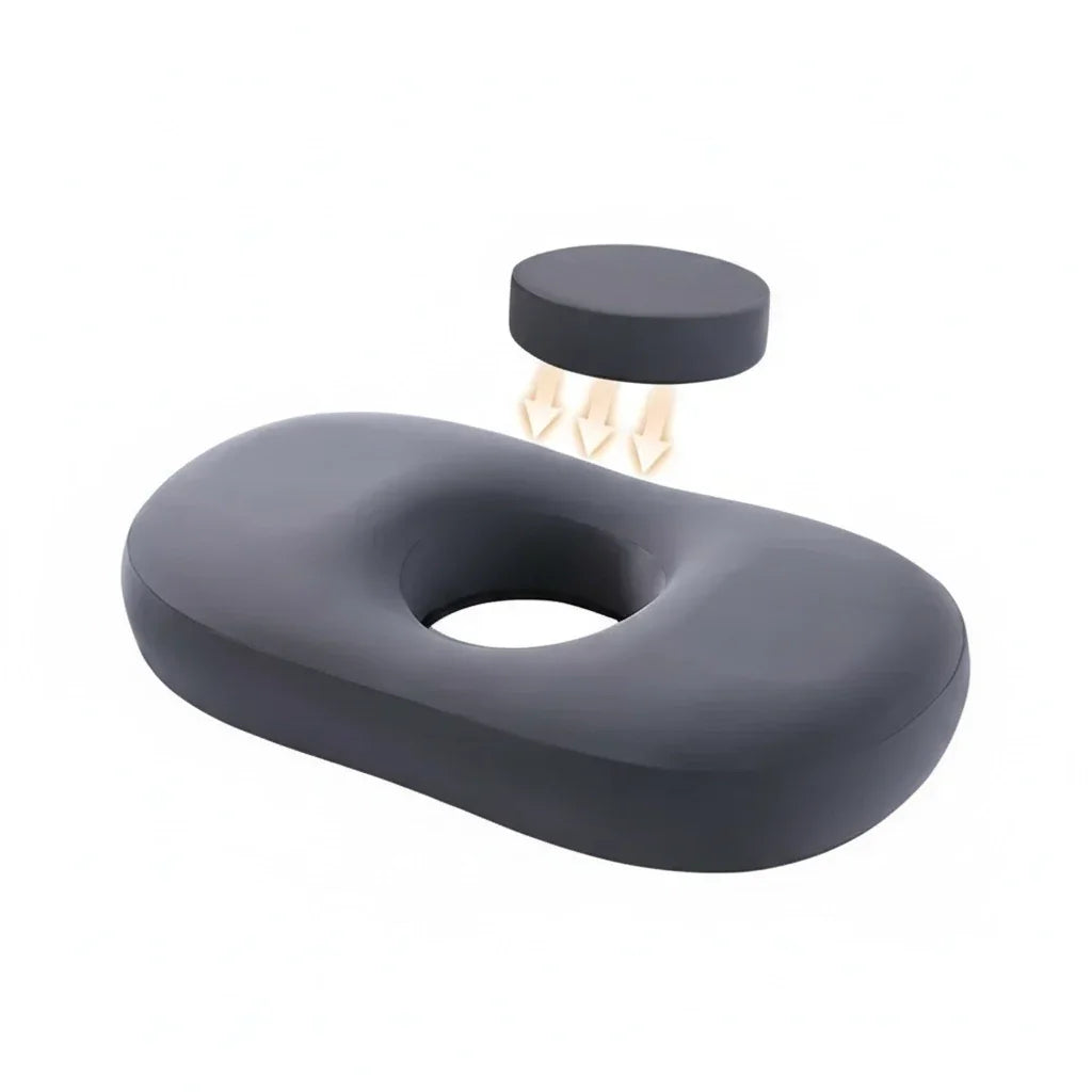 Black memory foam seat cushion with central hole and pressure relief illustration